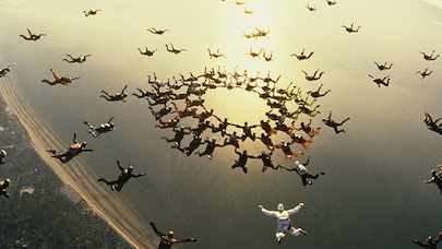 Skydivers in the clouds