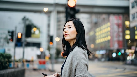 woman waiting at a signal