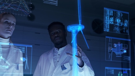 two engineers examine a digital twin of a wind generator