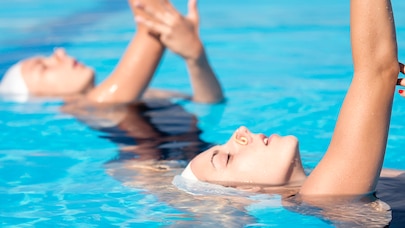 Synchronized swimmers in a pool