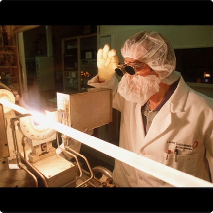 Engineer examining fiber optical cable 