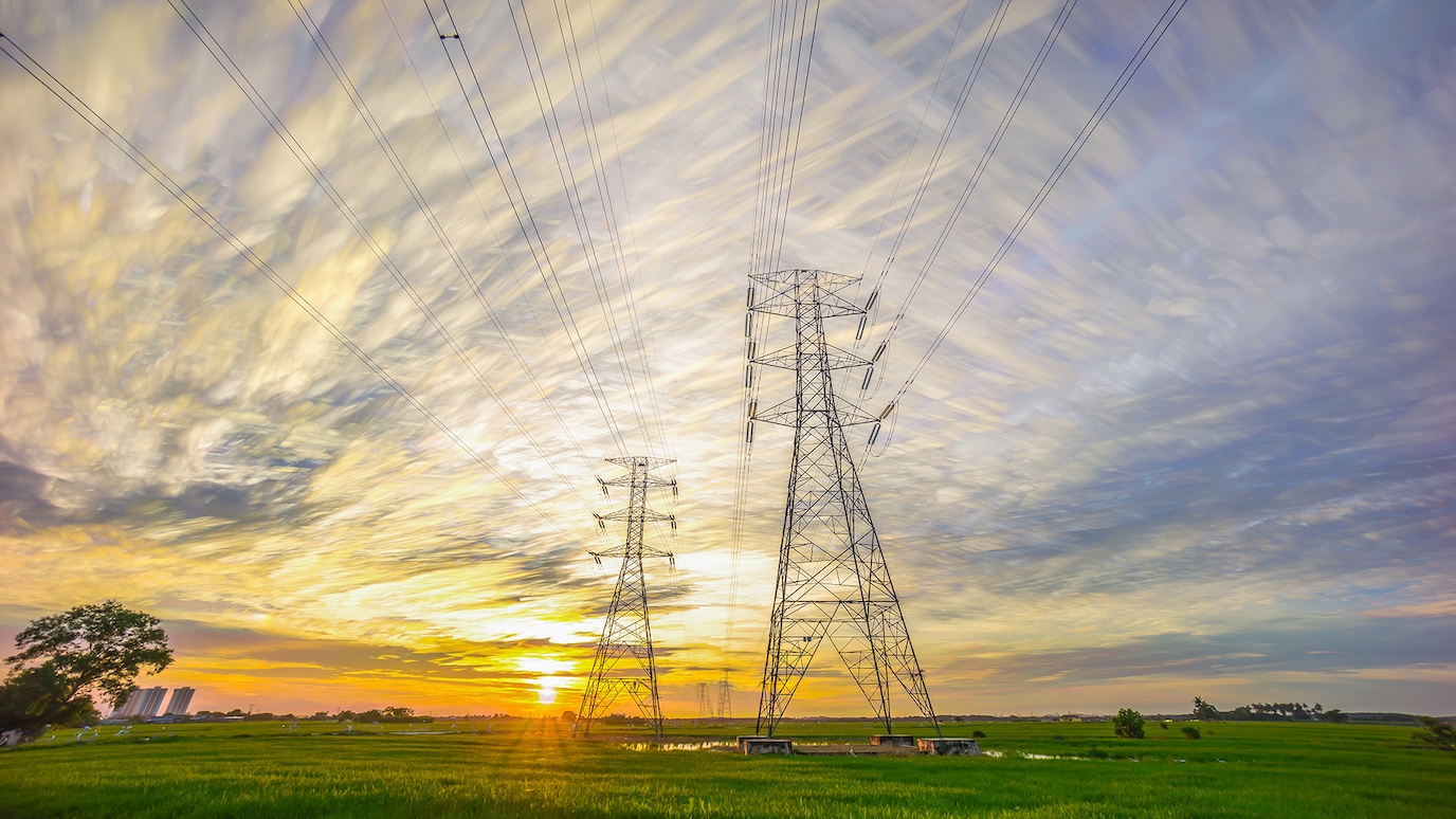 electricity pylons in field