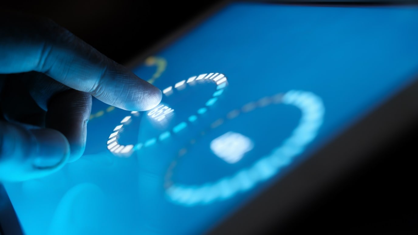 man using touch screen device