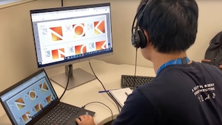 A summer intern working on their computer.