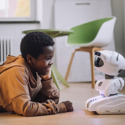 boy interacting with robot