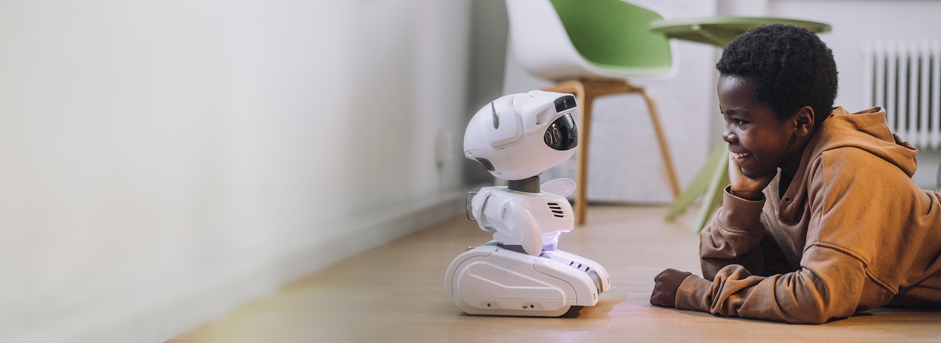 boy interacting with robot