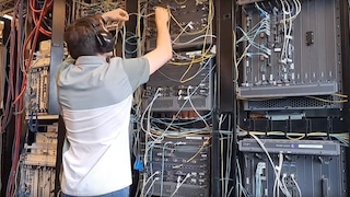 A summer intern working on servers.