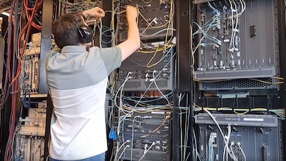 A summer intern working on servers.