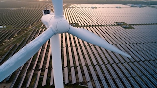 Wind turbine overlooking solar fam