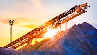 Conveyor belt at mine at sunset