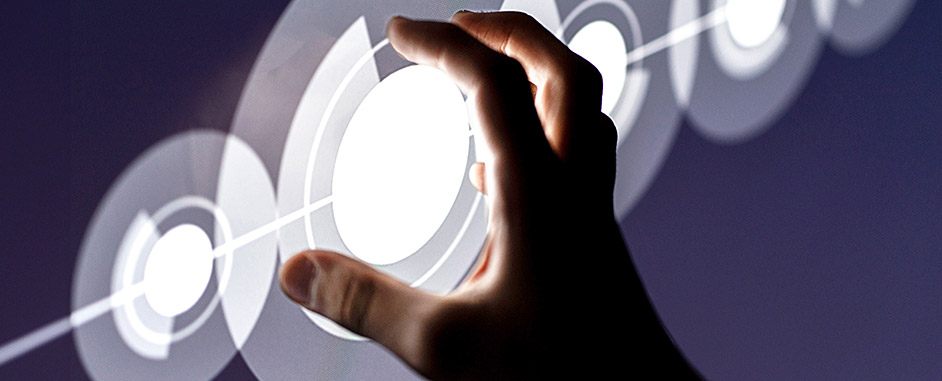 A hand reaching out to touch a digital circle.