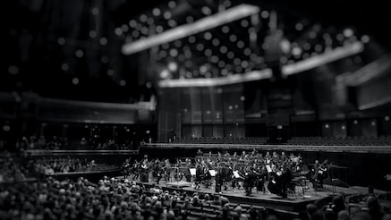 Black and white photograph of orchestra on stage