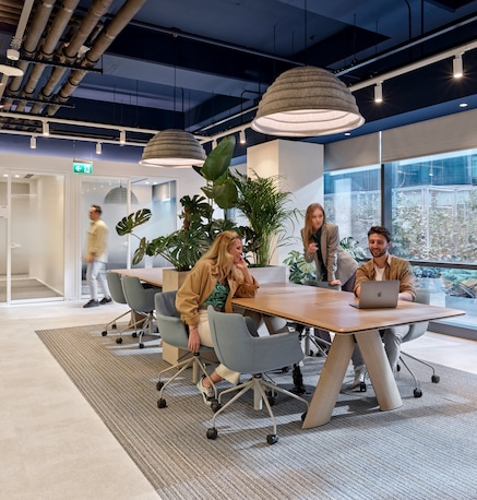 people around a table in office