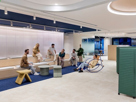 people chatting in office lobby