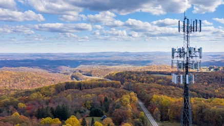 Antennae overlooking forested landscape