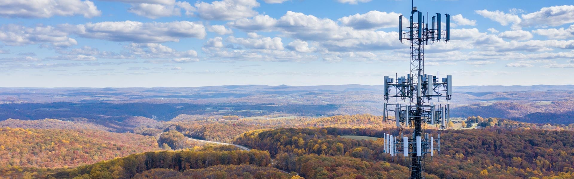 Antennae overlooking forested landscape