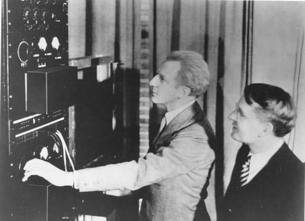 Leopold Stokowski and Harvey Fletcher adjusting the controls on early stereo equipment