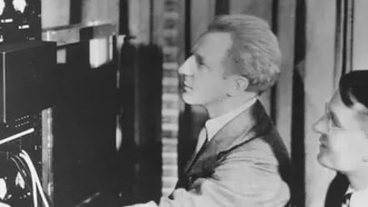Leopold Stokowski and Harvey Fletcher adjusting the controls on early stereo equipment