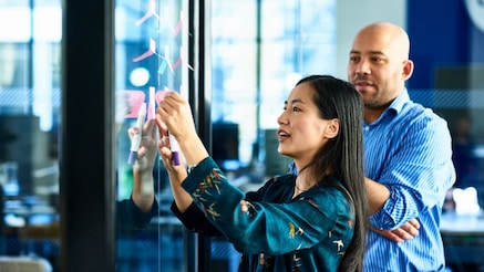 Two people working