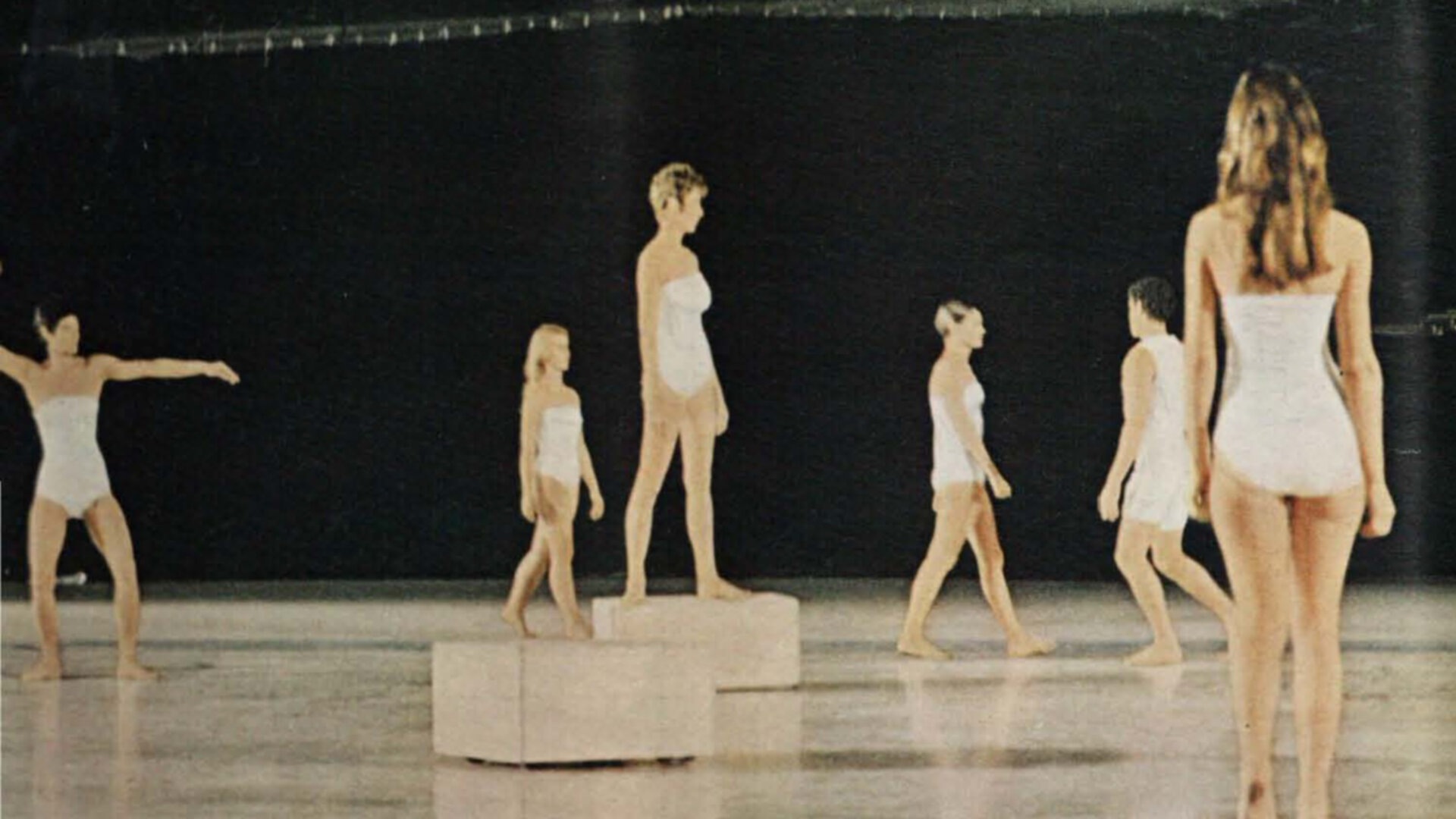 Dancers perform Deborah Hay’s “Solo.” The dancers interacted with eight radio-controlled moving platforms that moved around the floor