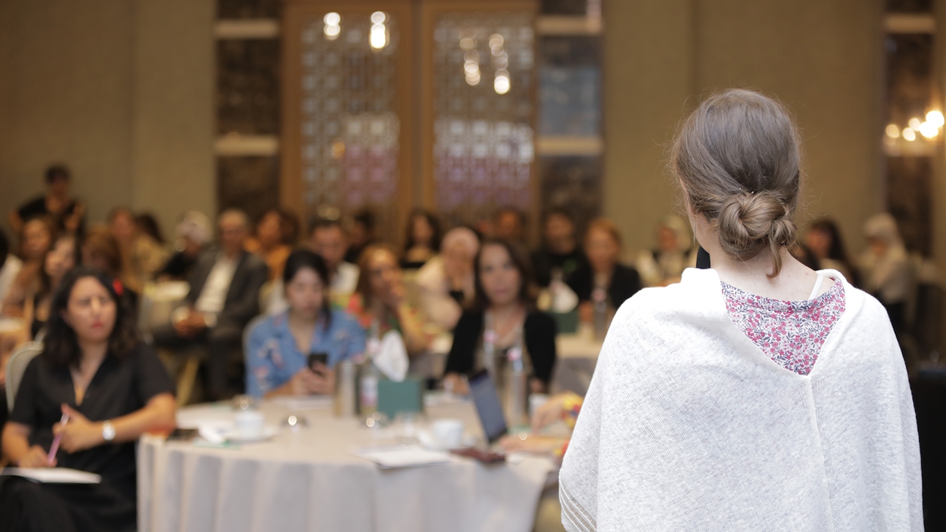 Woman addressing audience