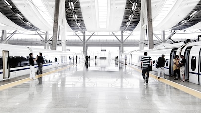 People boarding trains at train station