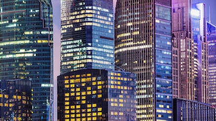Skyscrapers with lit windows at dusk