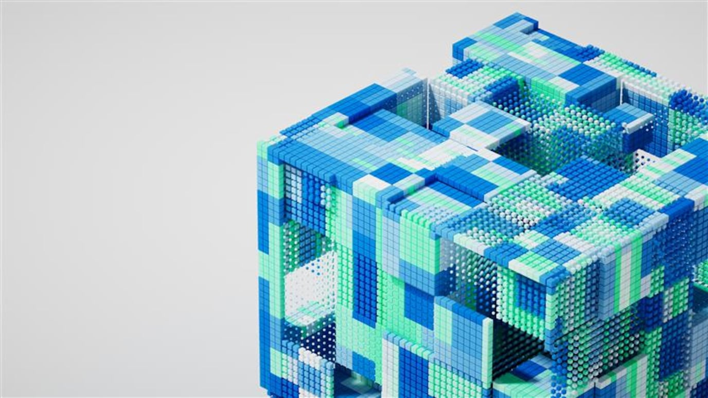 A 3D abstract cube made of colorful pixel-like blocks and spheres in blue, green, and white tones.
