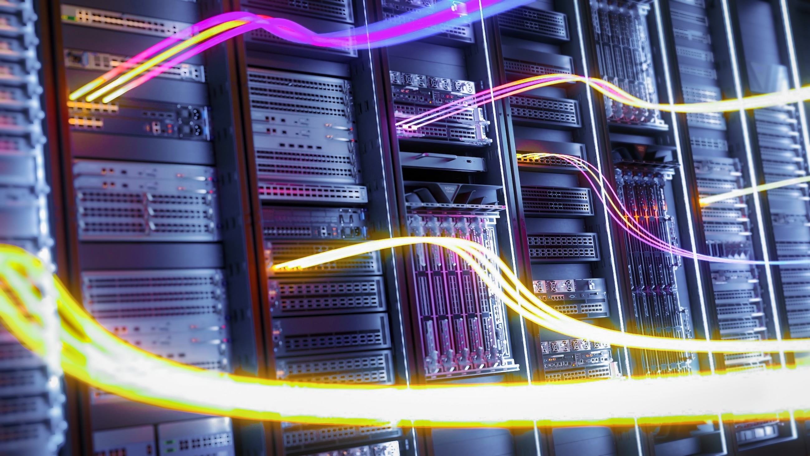 High-speed data flow concept with colorful light trails over modern server racks in a secure data center environment.