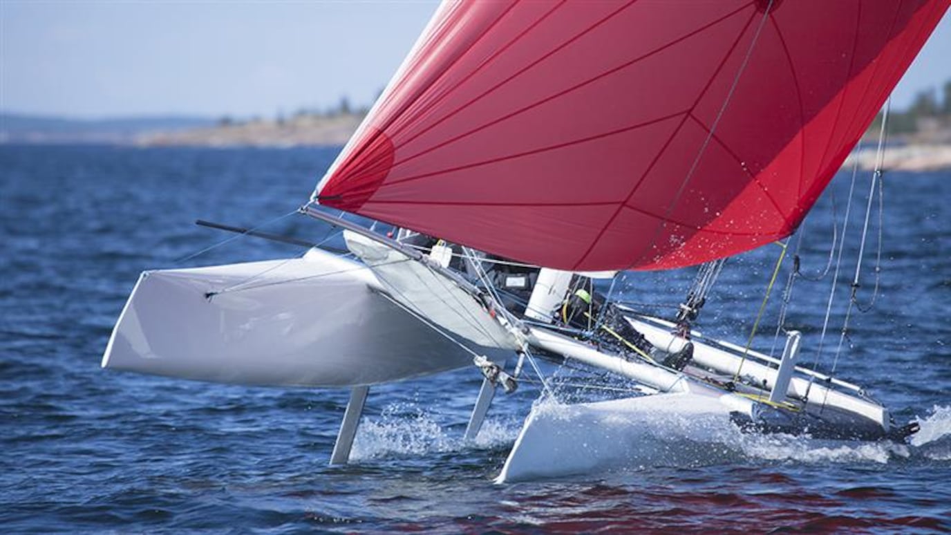 Sailboat on the sea with red sails