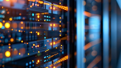 Close-up of illuminated server racks in a modern data center, showcasing cloud computing and secure digital infrastructure.