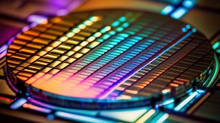 Magnifying glass above coloured screen