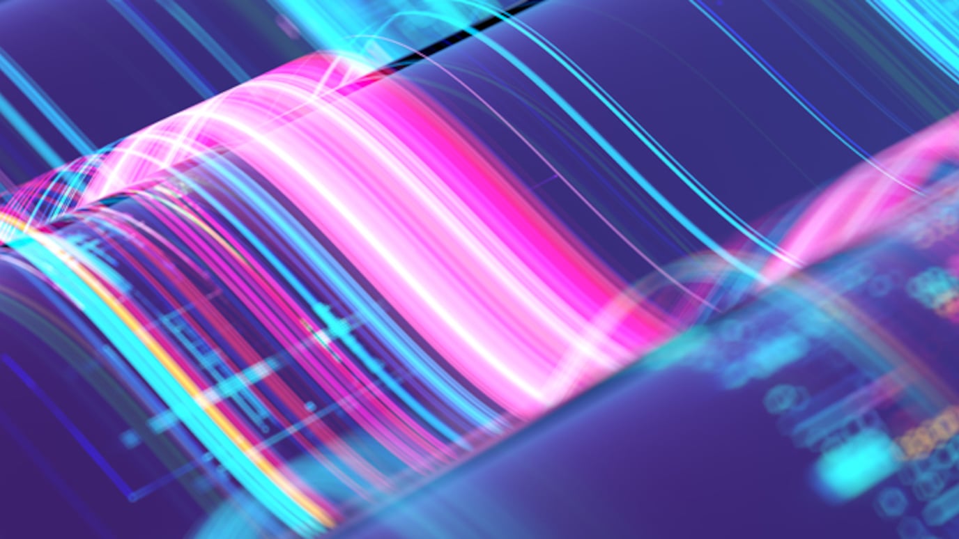 Abstract image of colorful light waves and data patterns symbolizing high-speed optical transport technology.