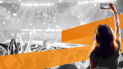 Woman at event, recording with her smartphone