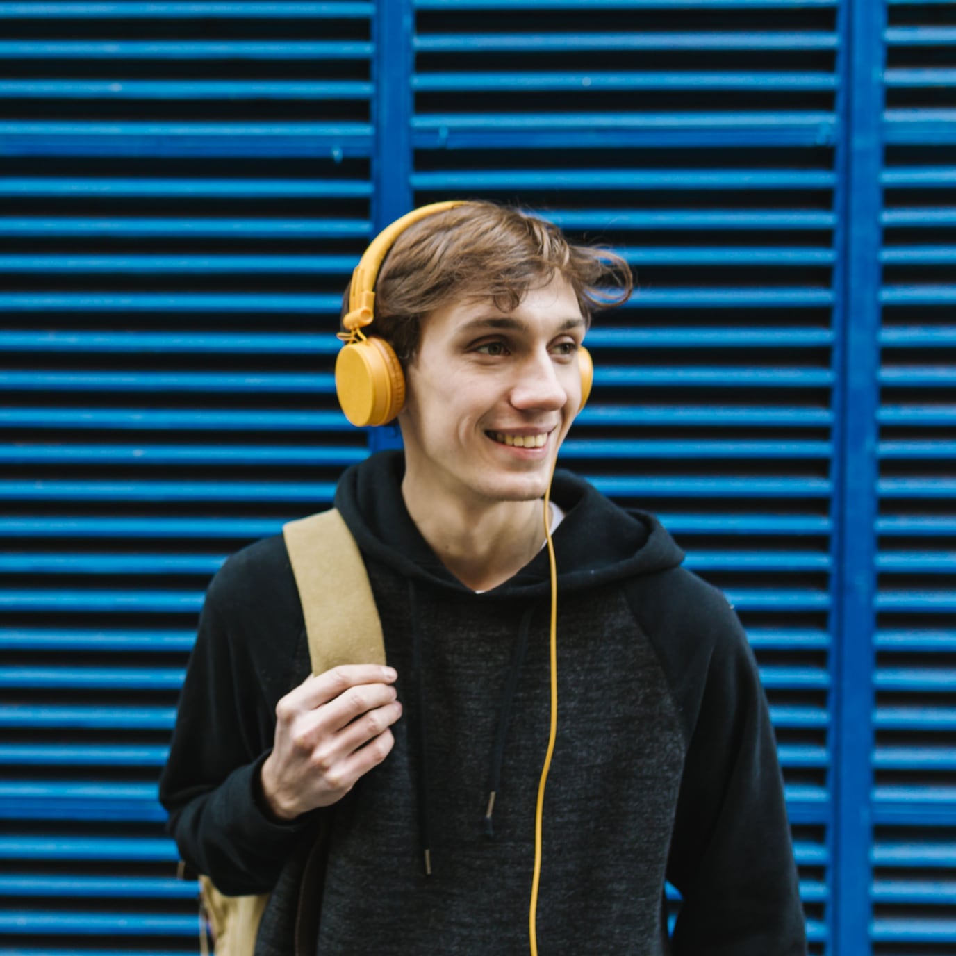 A person with a backpack and headphones
