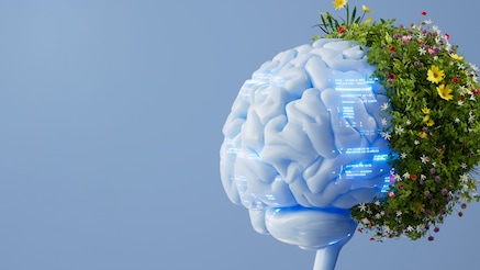 Brain with text projected onto it with plants growing from the back 