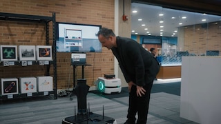 man taking with robot