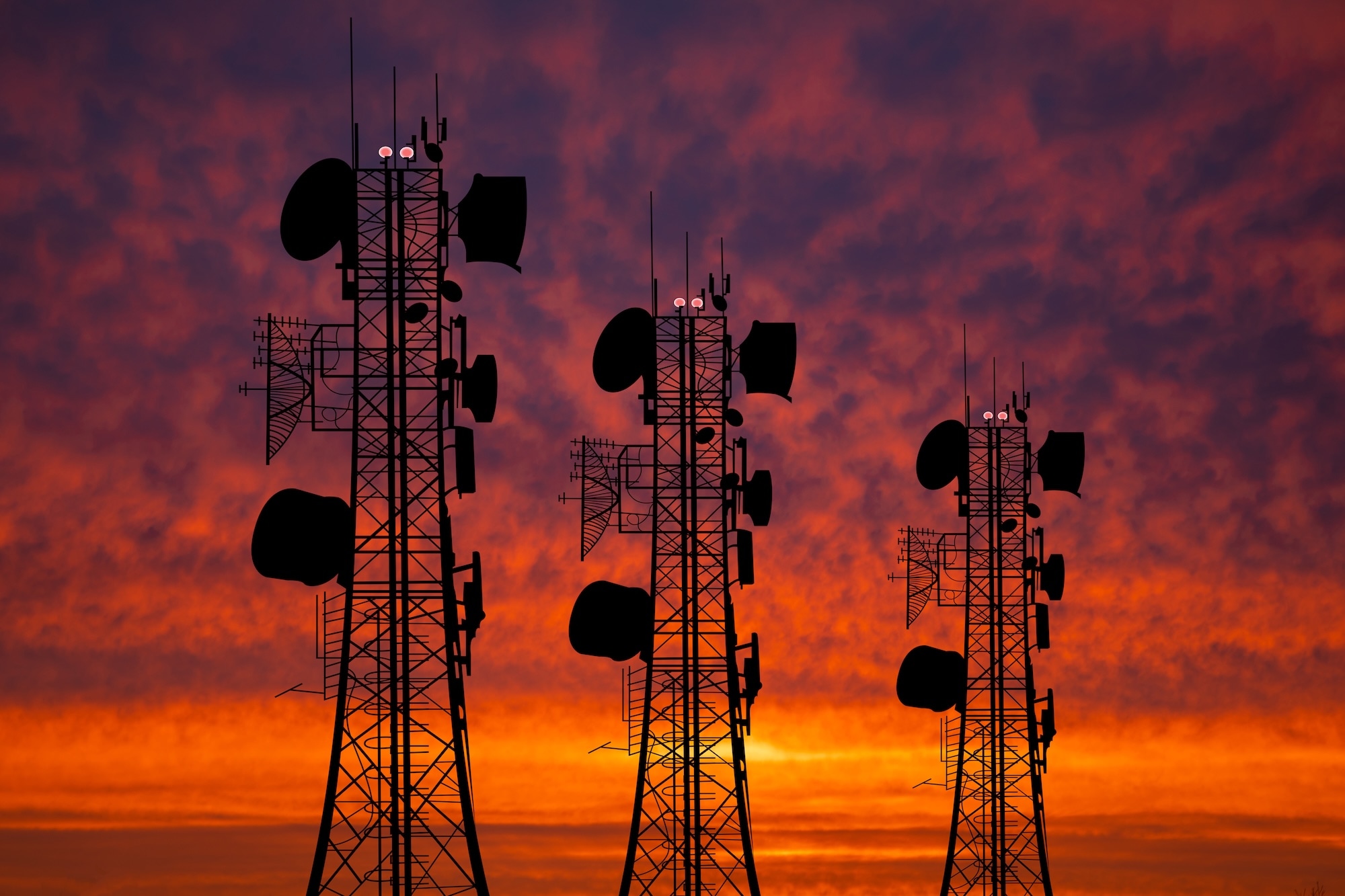 Radio towers at sunset