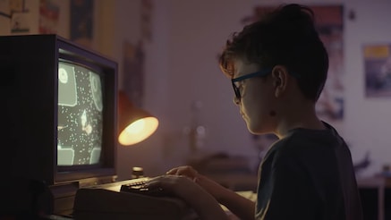 boy playing a computer game
