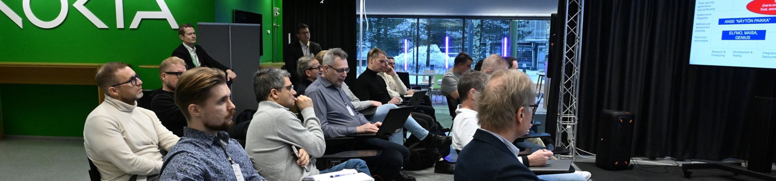 Meeting participants watching presentation