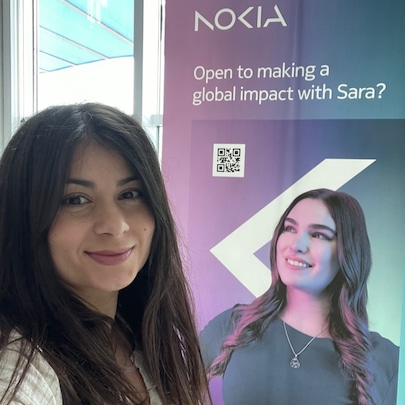 Nokia employee in front of an AR banner