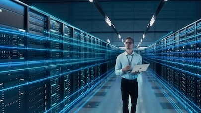 an IT technician standing in a data center