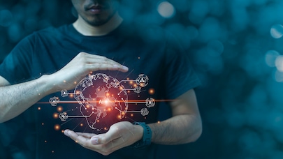 Man holding glowing AI-powered digital globe with global network connections and data icons.