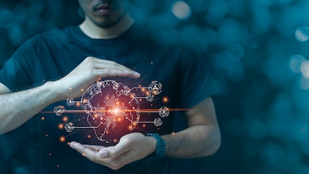 Man holding glowing AI-powered digital globe with global network connections and data icons.