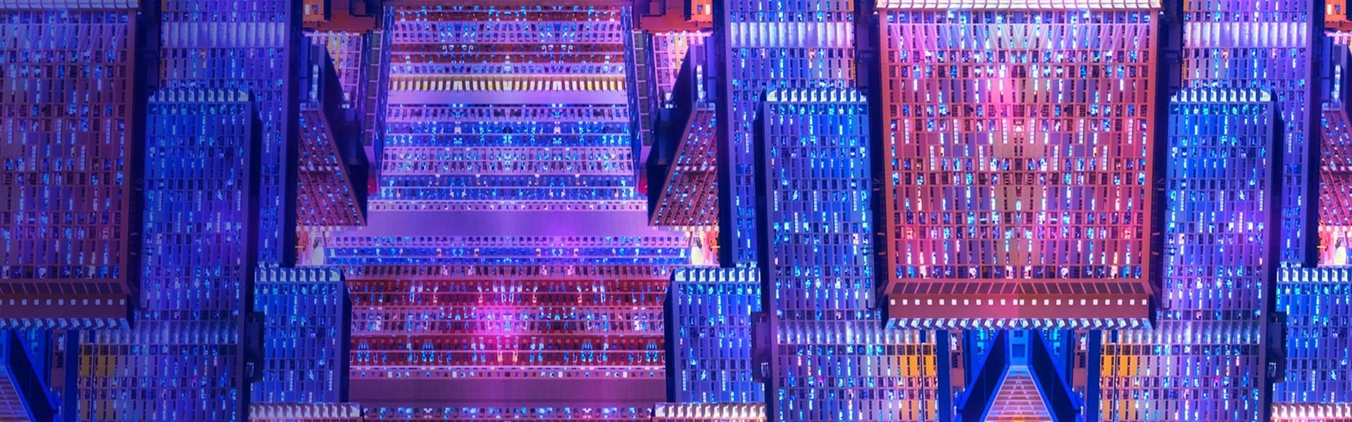 Futuristic data center with symmetrical server racks glowing in blue and pink neon lights, high performance server hubs.
