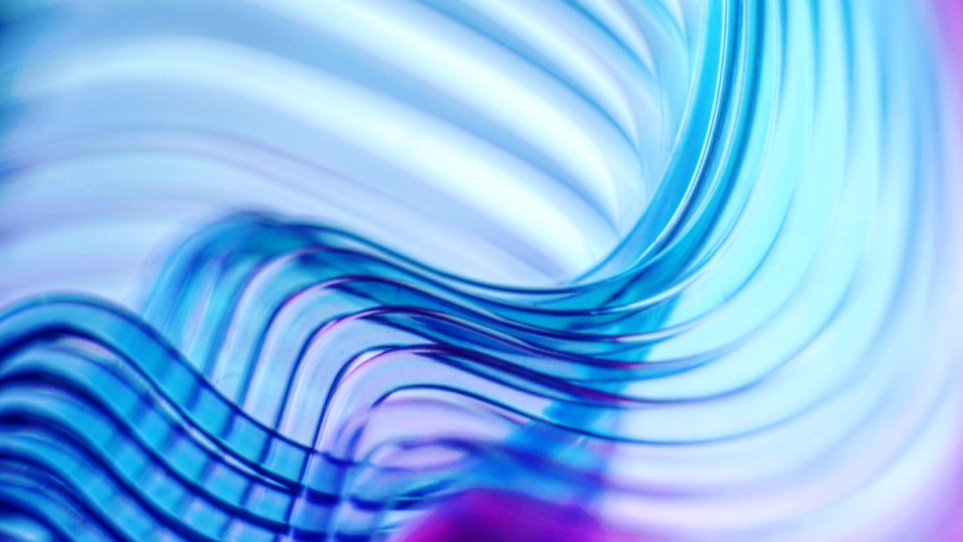 Abstract blue and purple flowing waves with gradients and fluid motion background