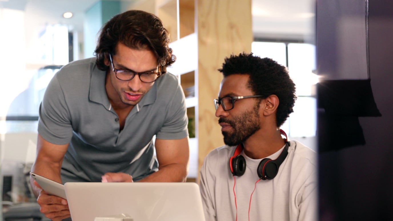 Two people working with each other