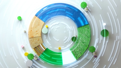 Circular infographic with segments in blue, green, wood, and circuit pattern, surrounded by abstract dots and motion lines.