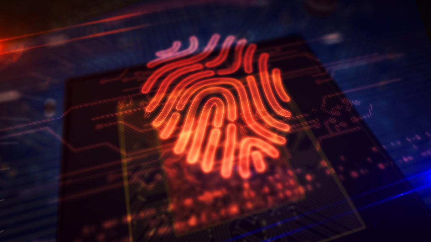 Glowing red biometric fingerprint over microchip and circuit board symbolizing digital security and authentication.