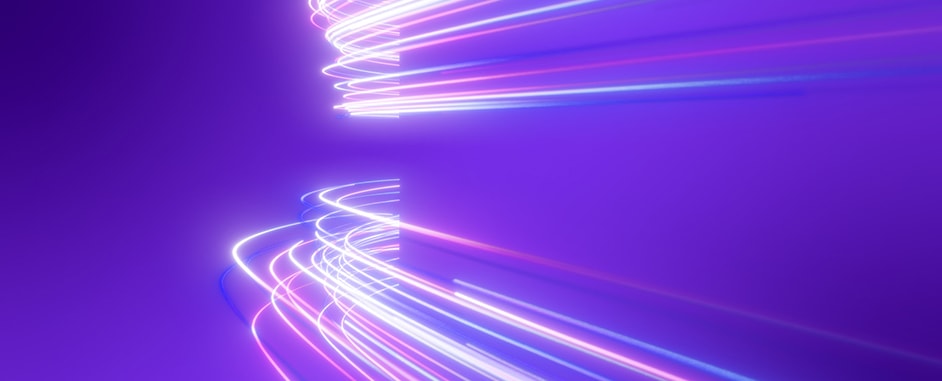 Abstract neon light trails curving on a purple background, futuristic motion effect